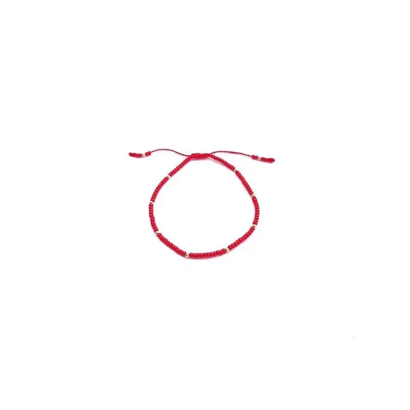 Pulsera roja con puntos de oro
