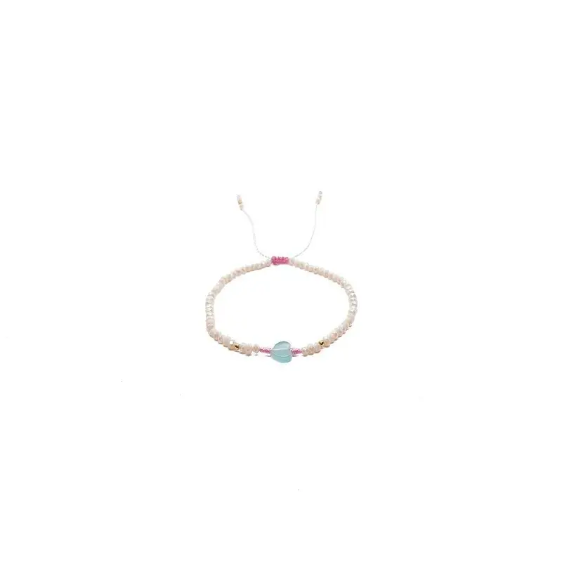 Pulsera de criSoundales beige con corazón al centro